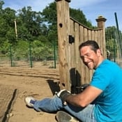 Man mending a garden fence