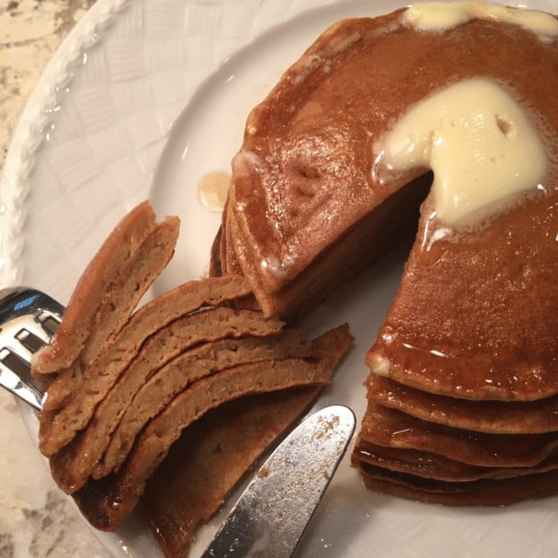Pumpkin Pancake Stack with a wedge cut out, on a plate