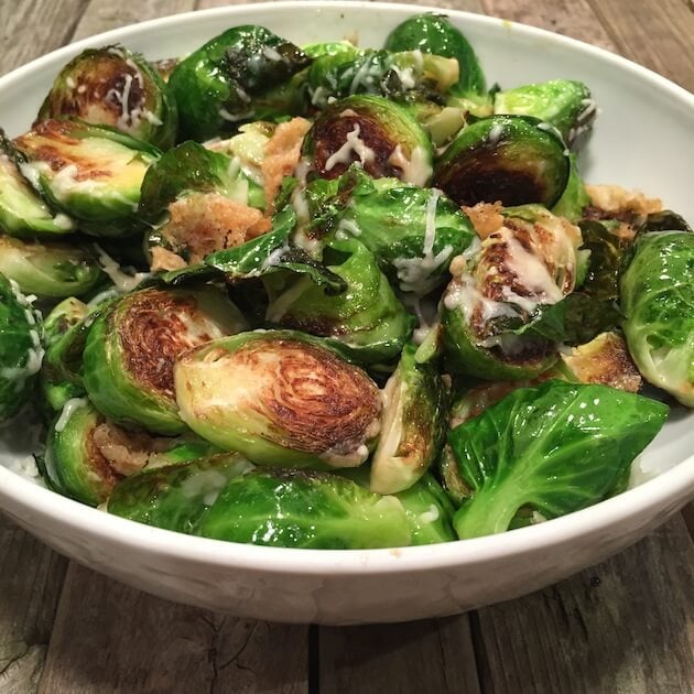 serving bowl of cooked brussels sprouts with cheese