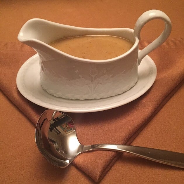 Gravy in boat with serving ladle