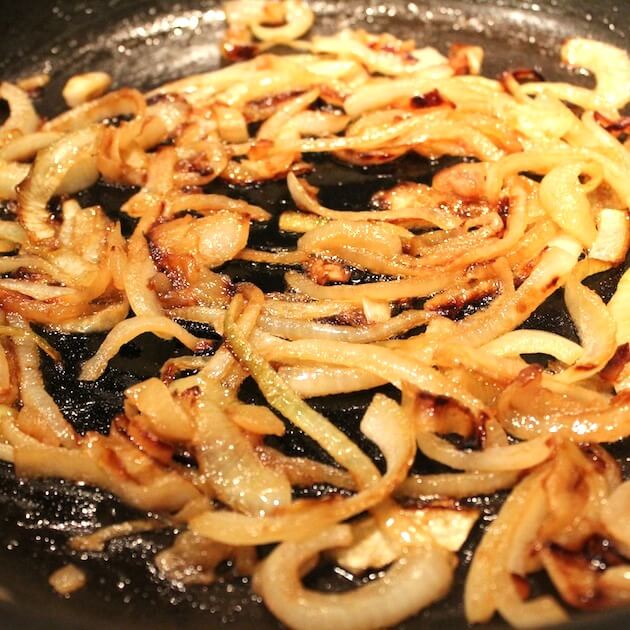 Onions caramelizing in saute pan