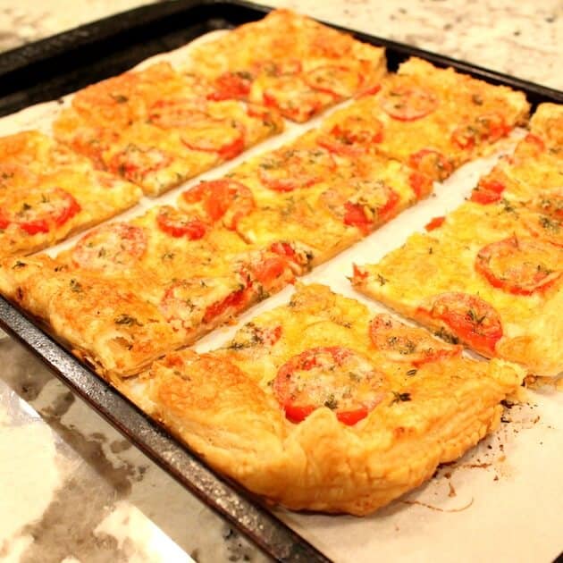 Tomato Cheddar Tart Cut Up on cookie sheet