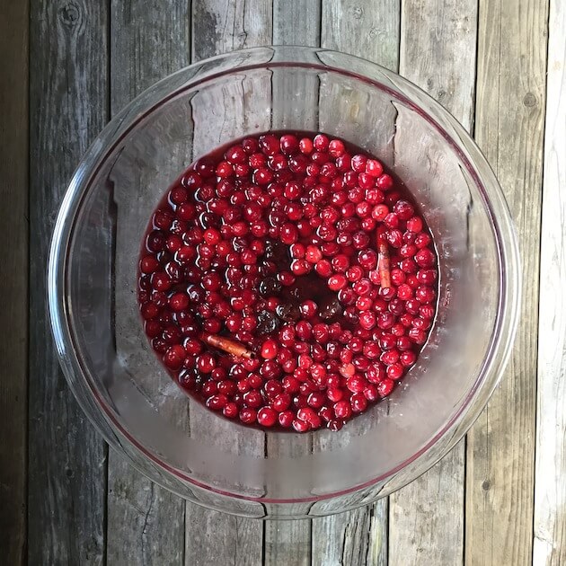 Fresh cranberries over top in glass bowl