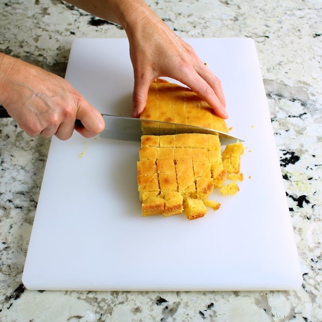 Cutting up cornbread for turkey stuffing