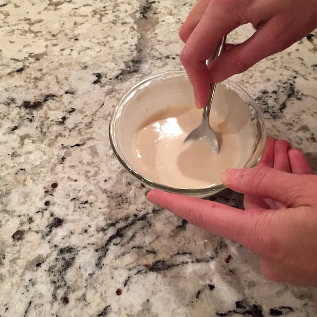 mixing flour and water in glass dish