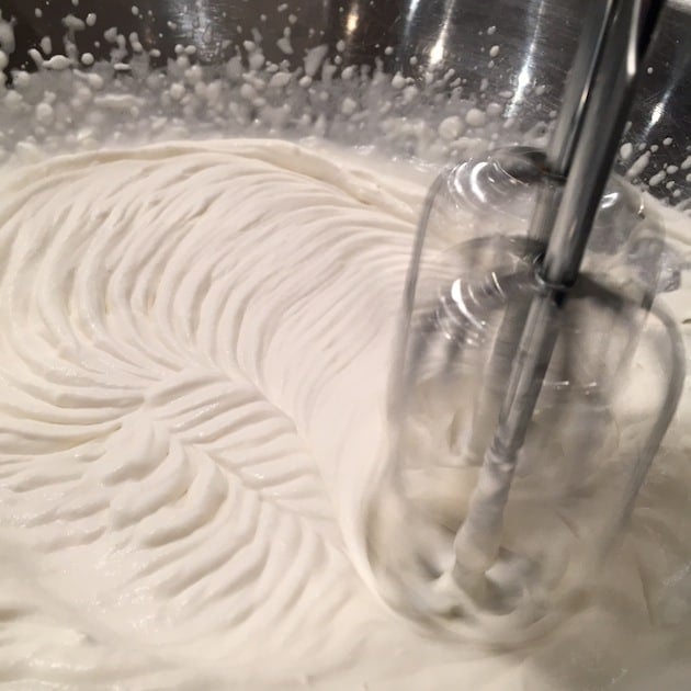 Electric mixer beating whipping cream