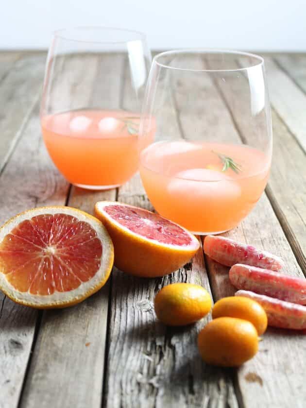 Two glasses of Aperol Punch with citrus fruit