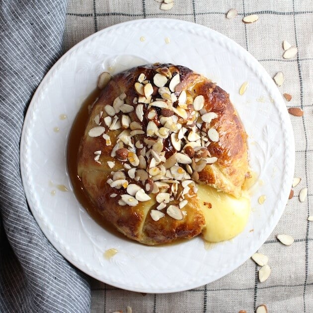 Baked Brie in Puff Pastry with Honey and Almonds, slice cut out