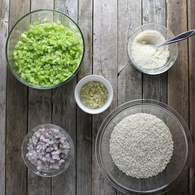 Creamy Parmesean Risotto Ingredients in small bowls on farm table