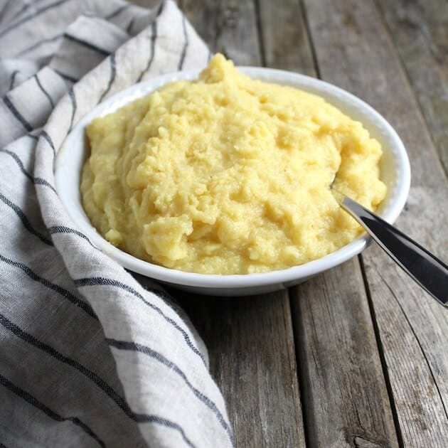 bowl of cooked Polenta on farm table 