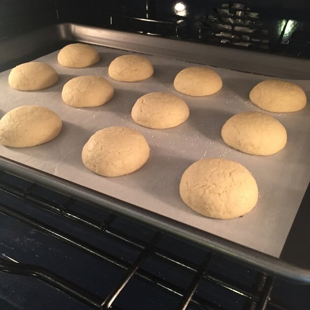 Sugar Cookies baking on a cookie sheet in the oven