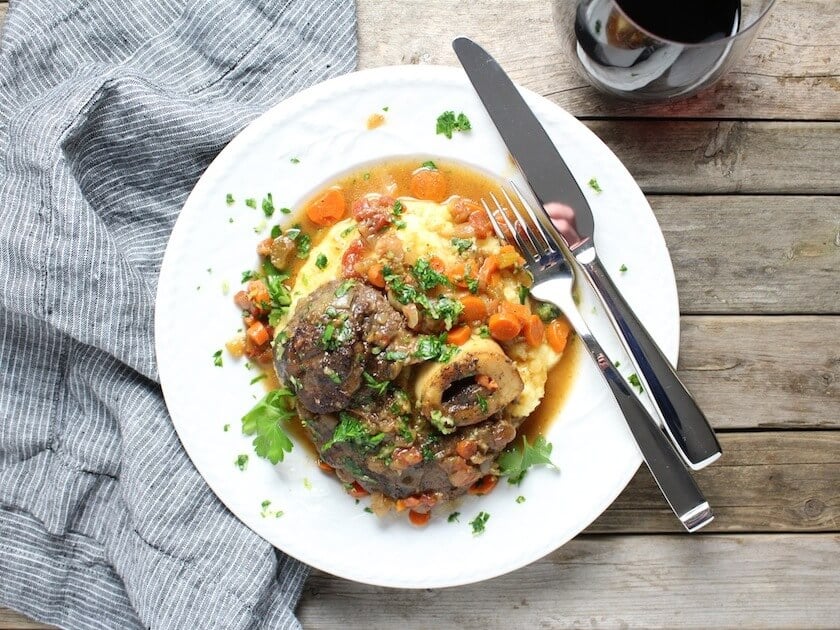 Veal Osso Buco on plate with polenta