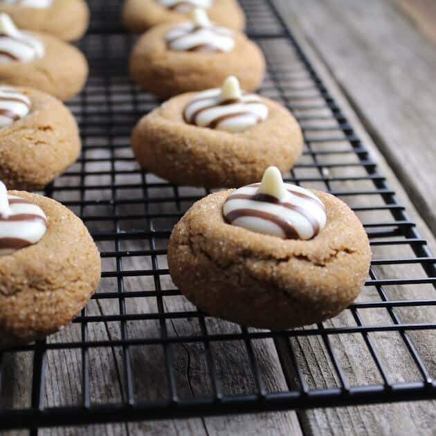 Gingerbread thumbprint Cookies on a wire rack