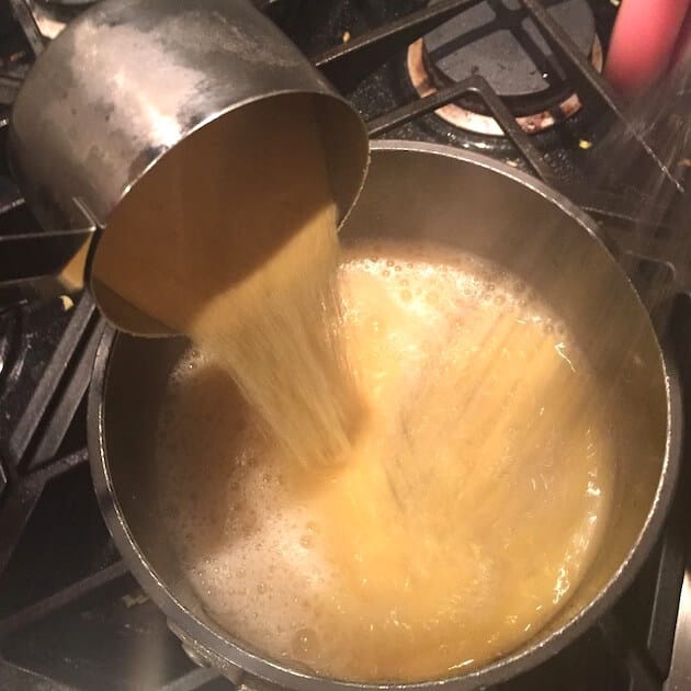 Adding uncooked Polenta to boiling chicken stock