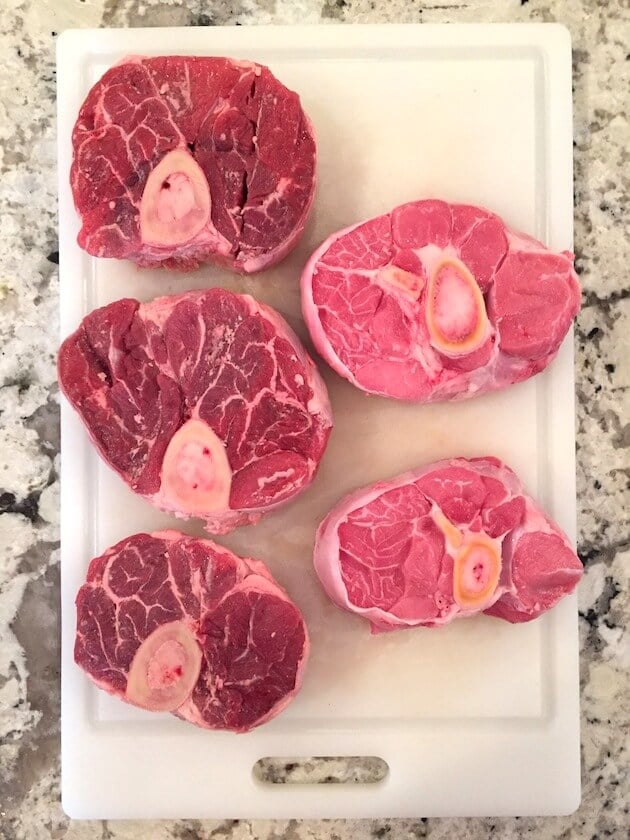 Uncooked Veal Osso Bucco &amp; Beef Shin on a cutting board