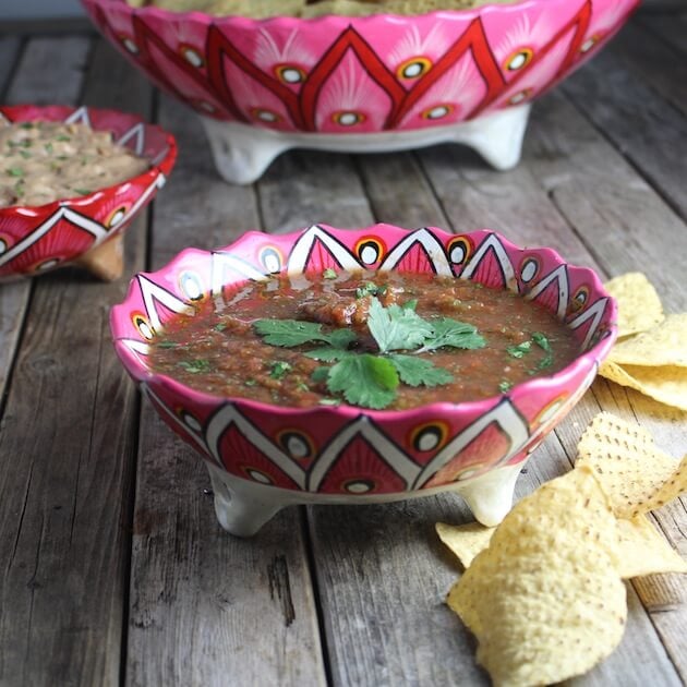 Bowl of Salsa with corn chips on table