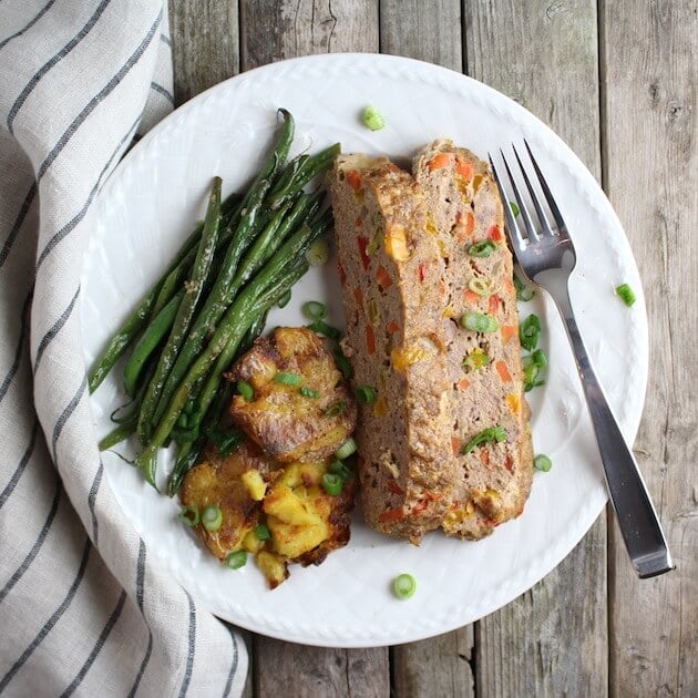 Farmer\'s Market Gluten Free Meatloaf on plate with asparagus and smashed potatoes