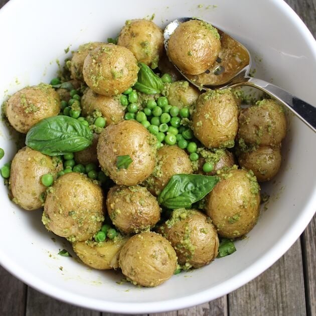 Pesto Potato Salad in white mixing bowl