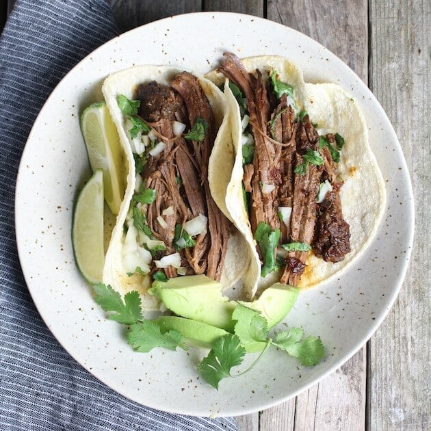 Two Slow Cooker Beef Barbacoa Tacos on a plate