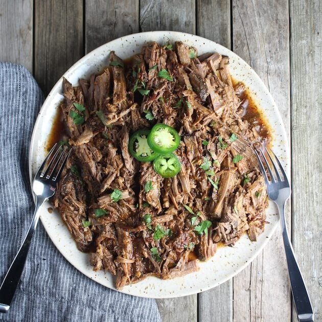 Slow Cooker Beef Barbacoa pulled on a plate