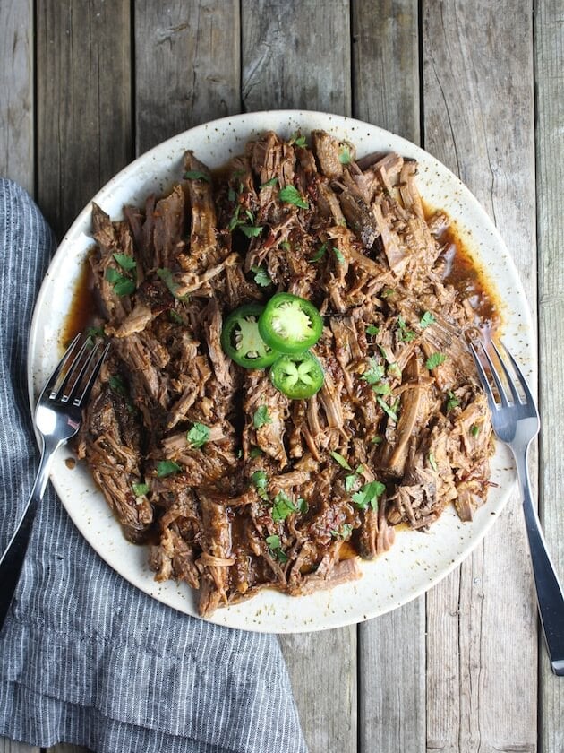 Slow Cooker Beef Barbacoa shredded on a platter