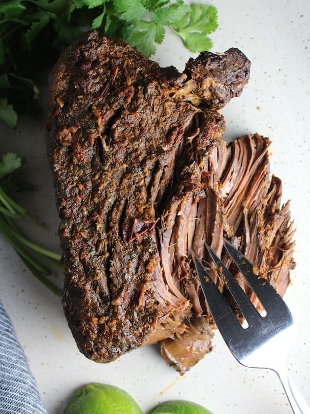 Pulling a Beef roast using forks 