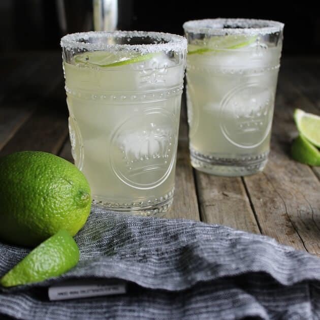 Two green St Germane Margaritas with salted rim