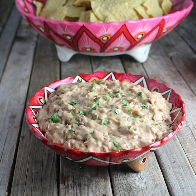 Bean dip in a festive mexican pottery bowl