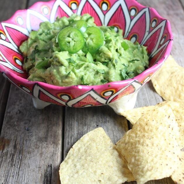 Eye level guacamole in decorative mexican serving bowl