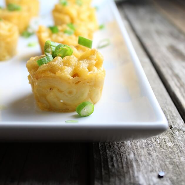 Mac N Cheese Bite with green onions on a platter