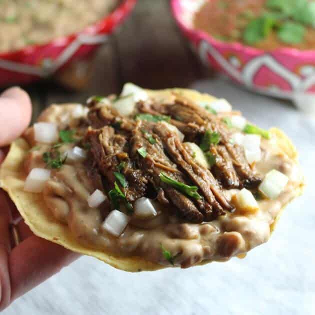 Beef barbacoa on crunchy corn tostata