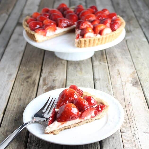 Piece of Strawberry Mascarpone Tart on a plate with fork