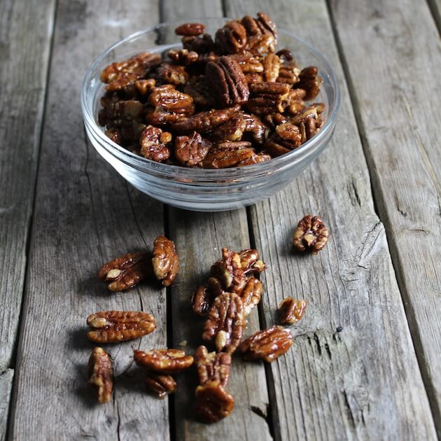 Candied nuts in a glass bowl on farm table