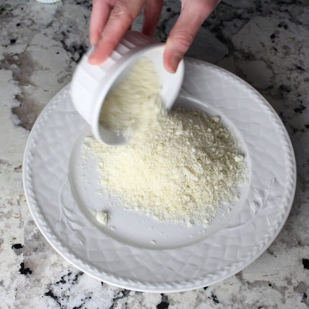 Adding parmesan to plate
