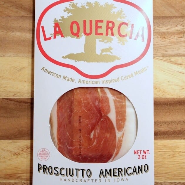 Package of Prosciutto on cutting board 