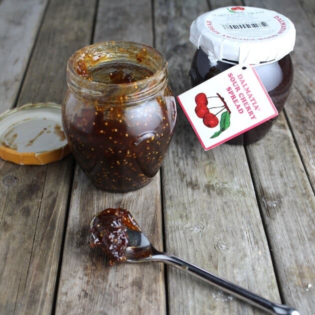 Fig Spread &amp; Sour Cherry Spread jars on farm table