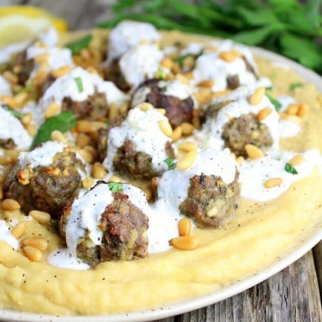 Lamb Meatballs on a plate of purees yellow peas 