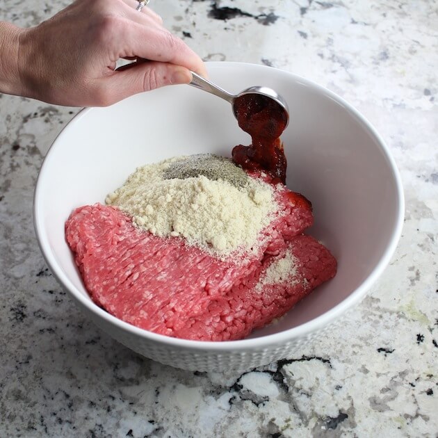 Adding Gouchujang to bowl of meatball ingredients