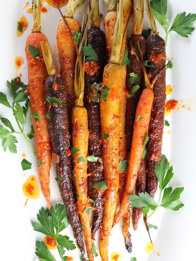 Honey Harissa Rainbow Carrots with harissa on platter