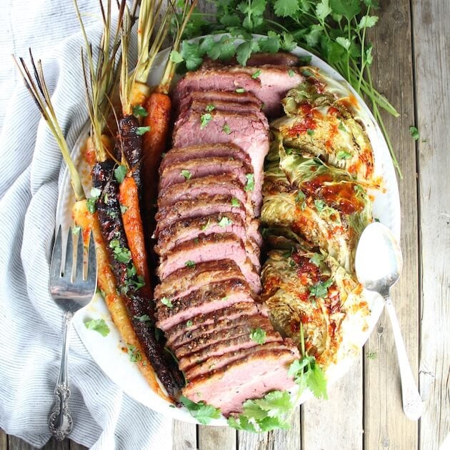 Corned Beef And Cabbage on a platter with carrots