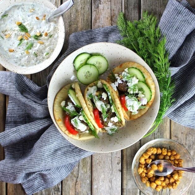 Lamb Meatballs in pita sandwiches with cucumbers, feta, Tzatziki, and tomatoes