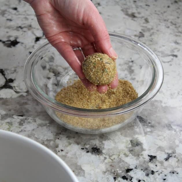 Rolling Vegetarian Meatballs in wheat germ