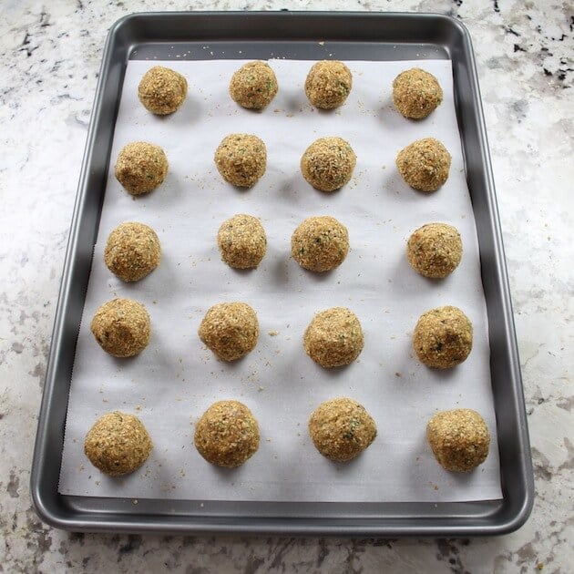 Vegetarian Meatballs Lined up on a baking sheet ready for cooking