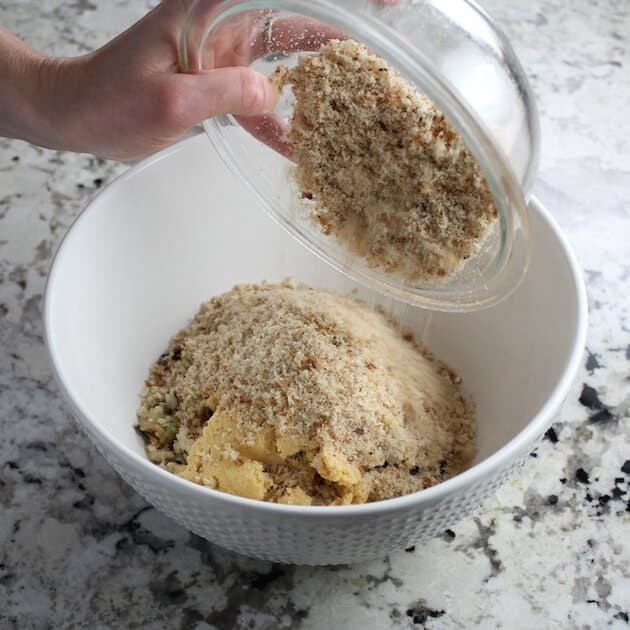 Adding breadcrumbs to mixing bowl