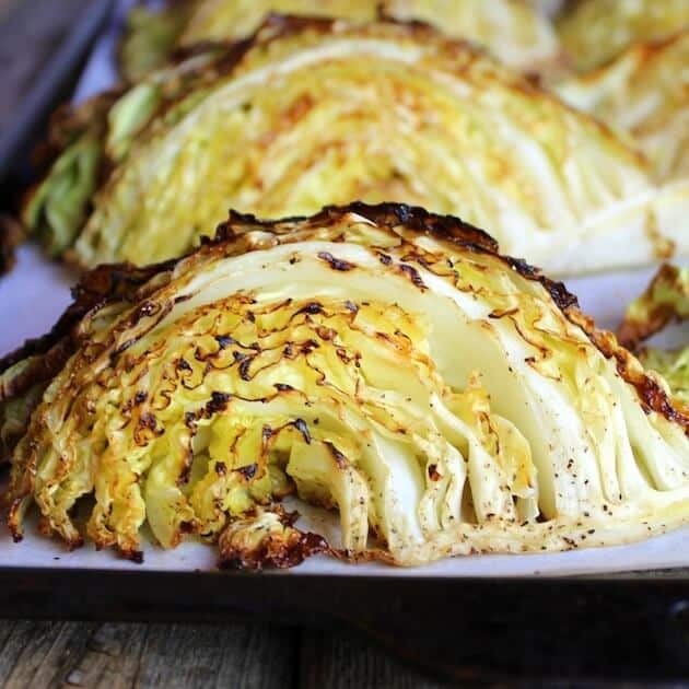 Close up roasted cabbage on a baking sheet
