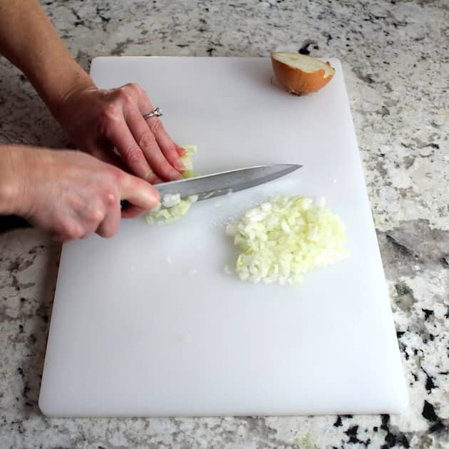 Chopping onion on cutting board