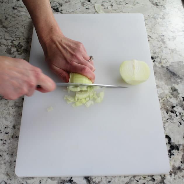 chopping onions on cutting board