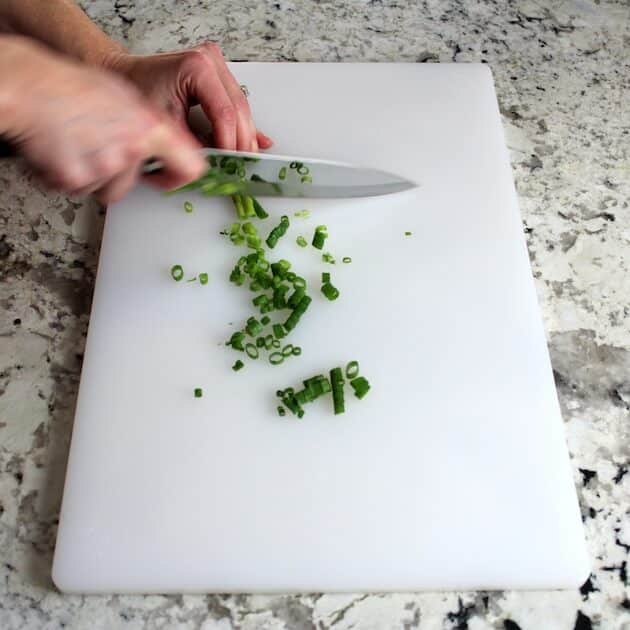 cutting up green onions 