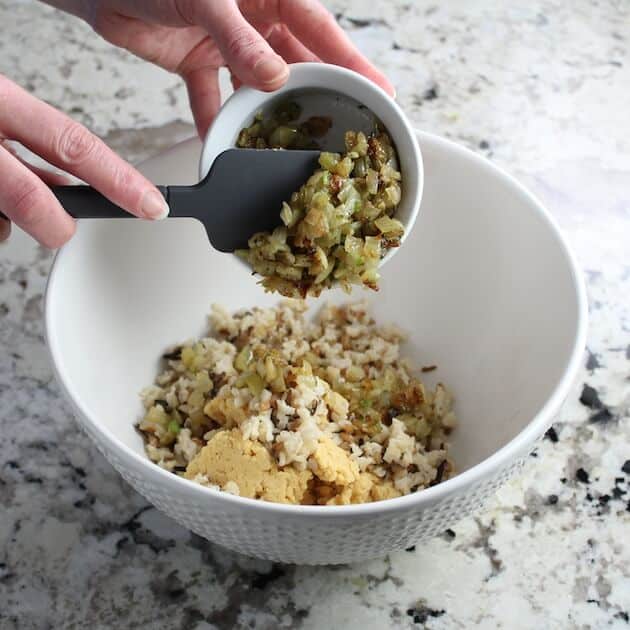 Adding veggies to mixing bowl