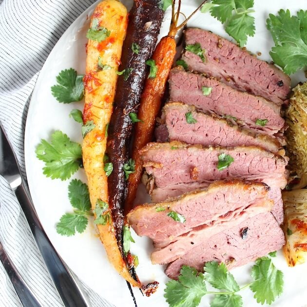 Sliced Corned Beef with carrots on plate